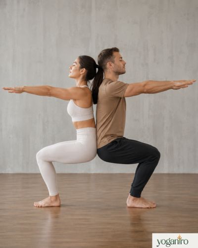 Double Chair Pose partner yoga exercise for strength and balance